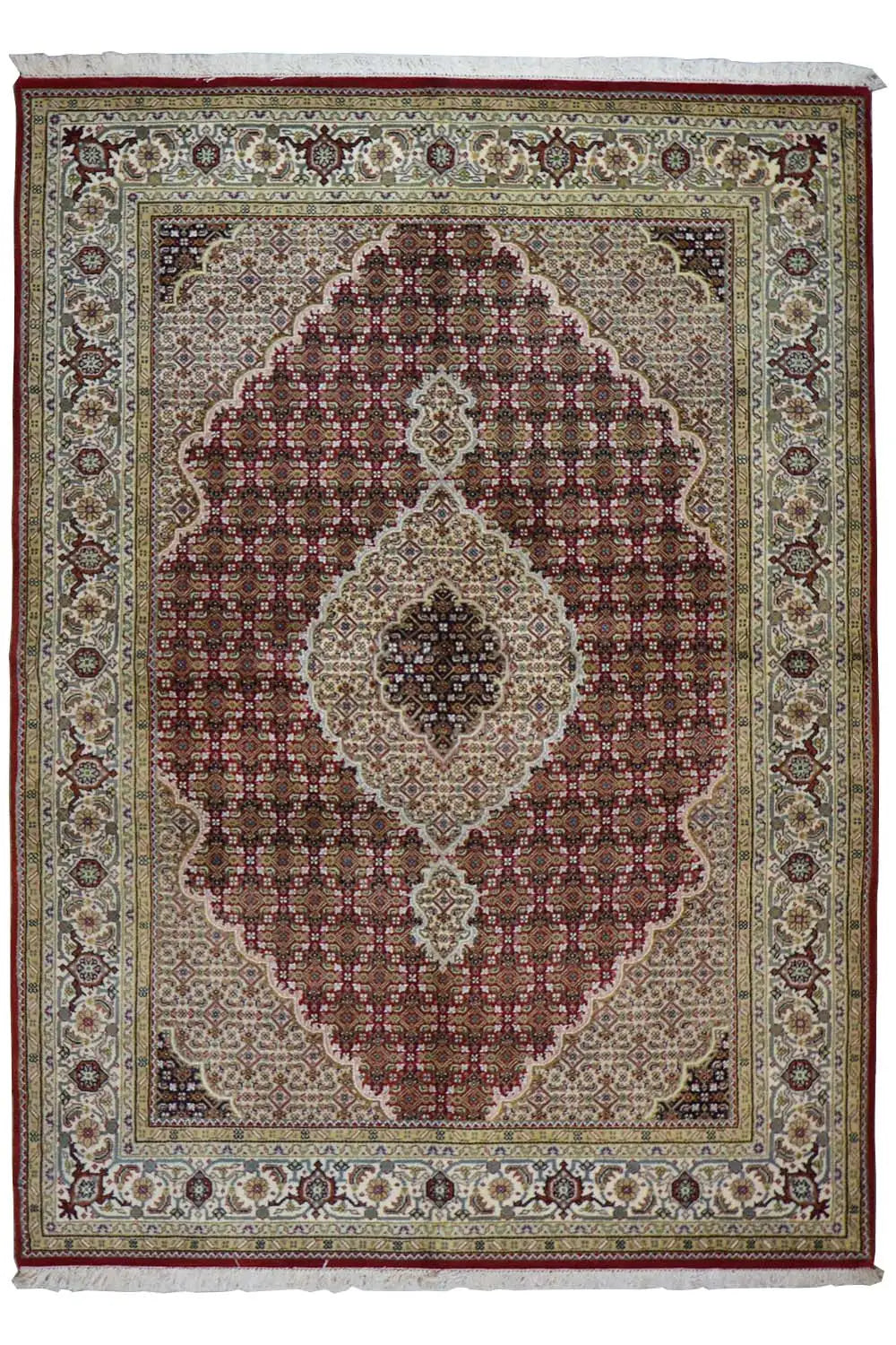 Oriental rug with a brown-and-white medallion pattern and dark border edging