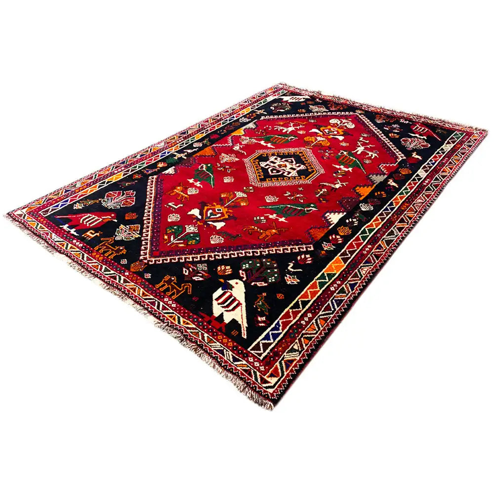 Shiraz rug 255x170 cm, red field with blue border and fine borders.