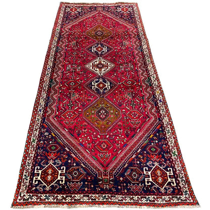 Red-and-blue runner with a central medallion and an even patterned border