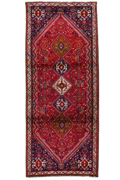 Rectangular runner with a red center and dark blue border ornaments
