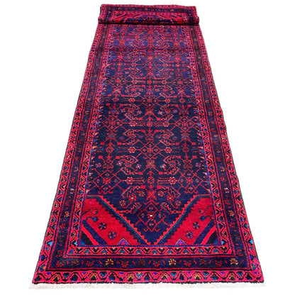 Hamadan runner from above: burgundy central field with dark blue borders and fringes