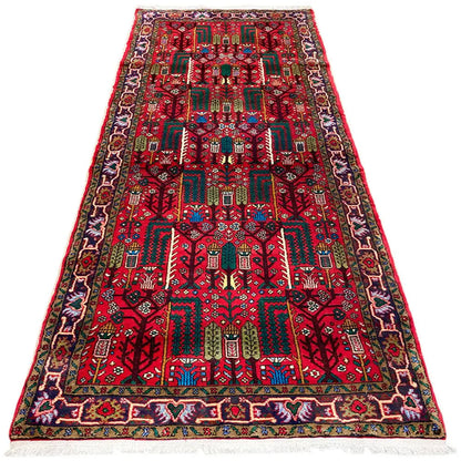 Oriental runner rug with a red detailed pattern, turquoise/green accents, and a wide border