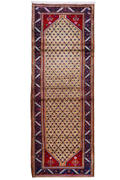 Oriental rug runner, front view: beige medallion field with a dark blue border and Bordeaux-red ornamentation