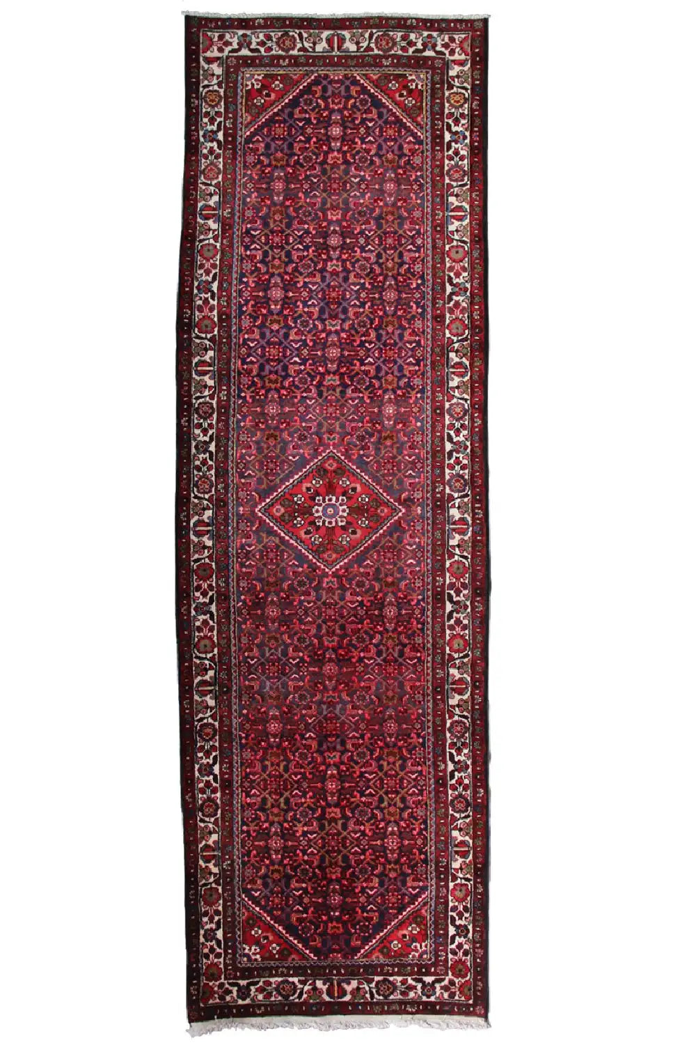 Narrow runner rug with a rectangular border pattern, red base and fringes