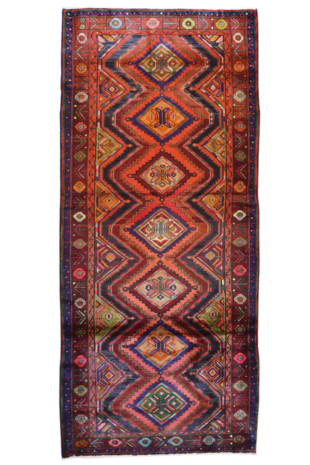 Oriental rug runner with a symmetrical diamond and zigzag pattern in blue, red, and beige