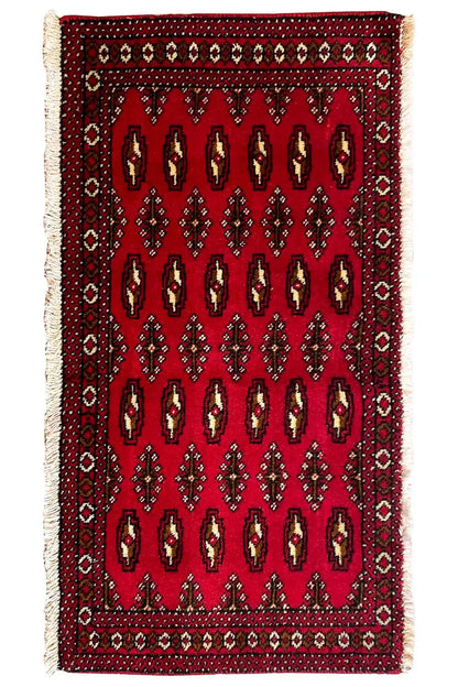 Poshti Turkmen carpet (95x47 cm), front view: red with repeated rows of symbols