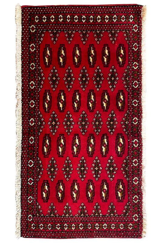 Poshti Turkmen carpet (95x47 cm), front view: red with repeated rows of symbols