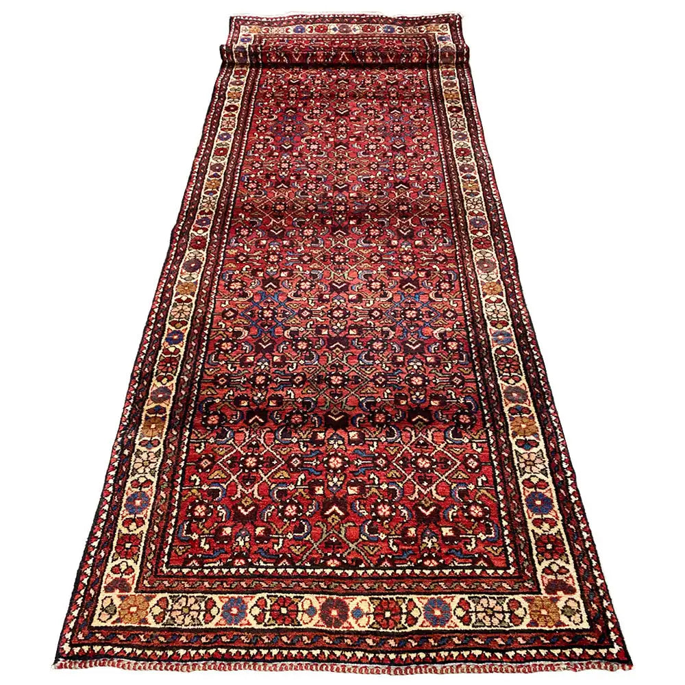 Hamadan runner with a dark border, burgundy center, and fine ornamental lines