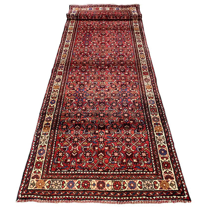 Hamadan runner with a dark border, burgundy center, and fine ornamental lines