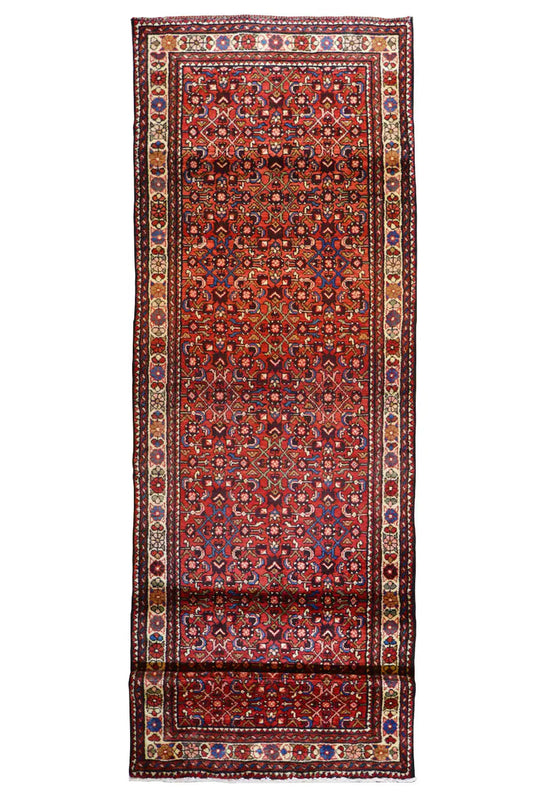 Hamadan runner in portrait orientation: burgundy background with a wide central border and ornamental panels