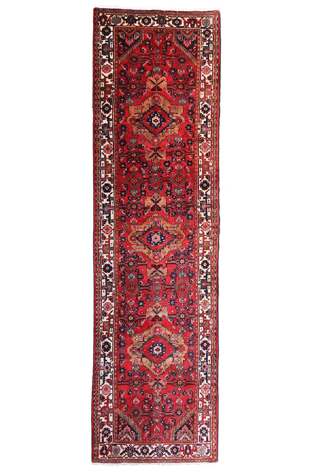Red rug in a classic Oriental design with dark borders and symmetrical medallions