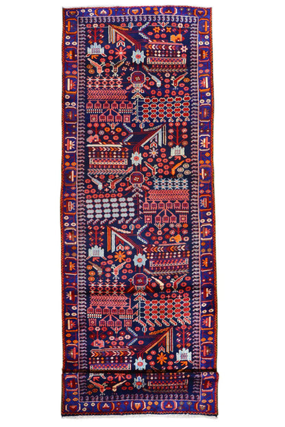 Top view of a runner rug with a colorful oriental pattern in red, blue, and beige