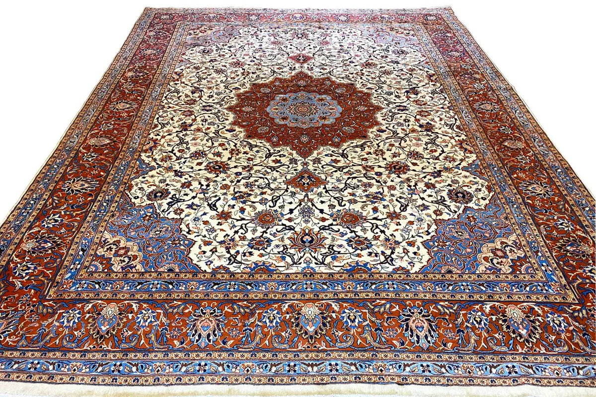 Tabriz oriental rug viewed from above: cream patterned field with a red center and blue border