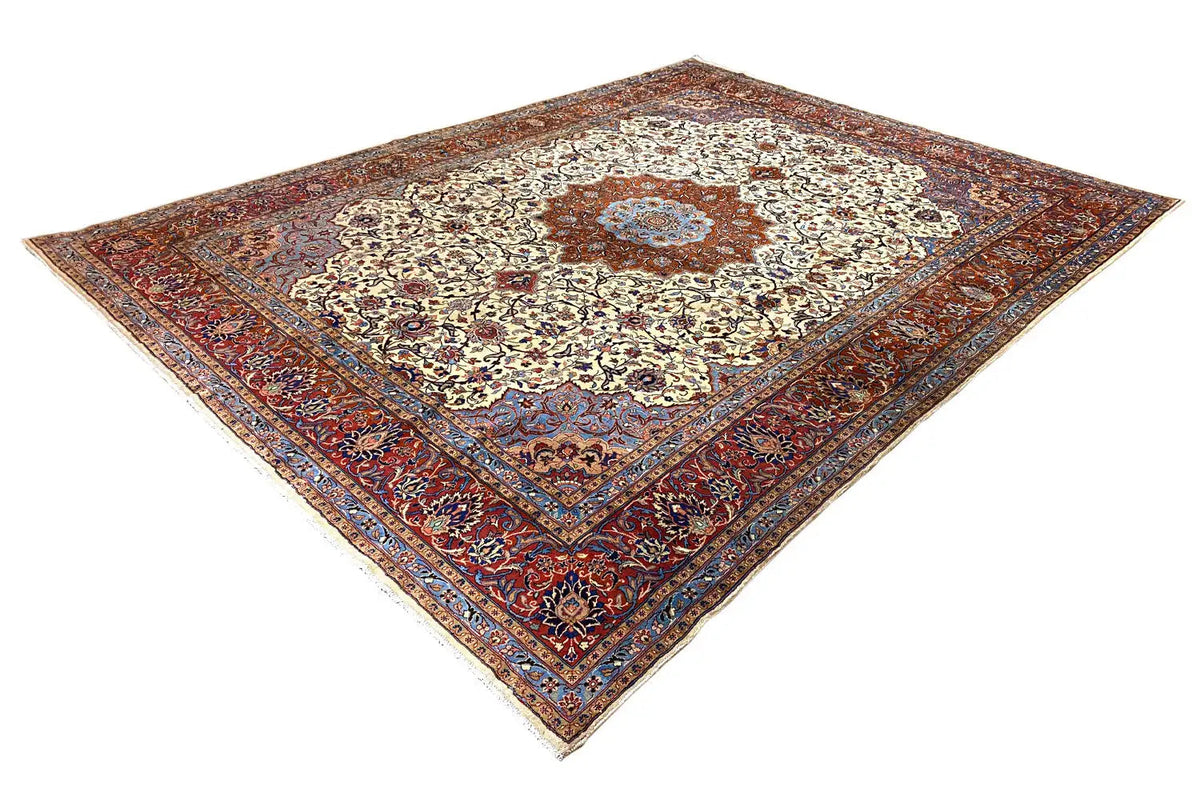 Tabriz oriental rug, angled view: cream center, red border frame