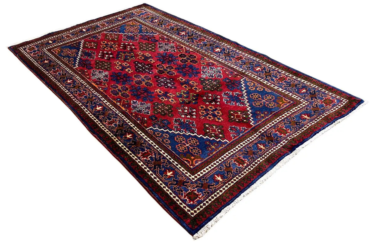 Hamadan rug with a red central field, dark blue border and ornaments