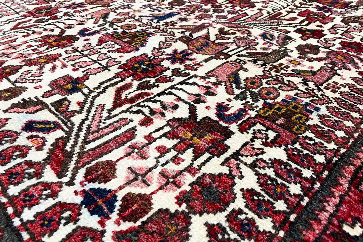 Close-up of the Oriental rug: colorful ornaments on a light background