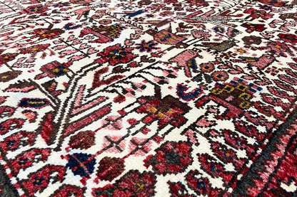 Close-up of the Oriental rug: colorful ornaments on a light background