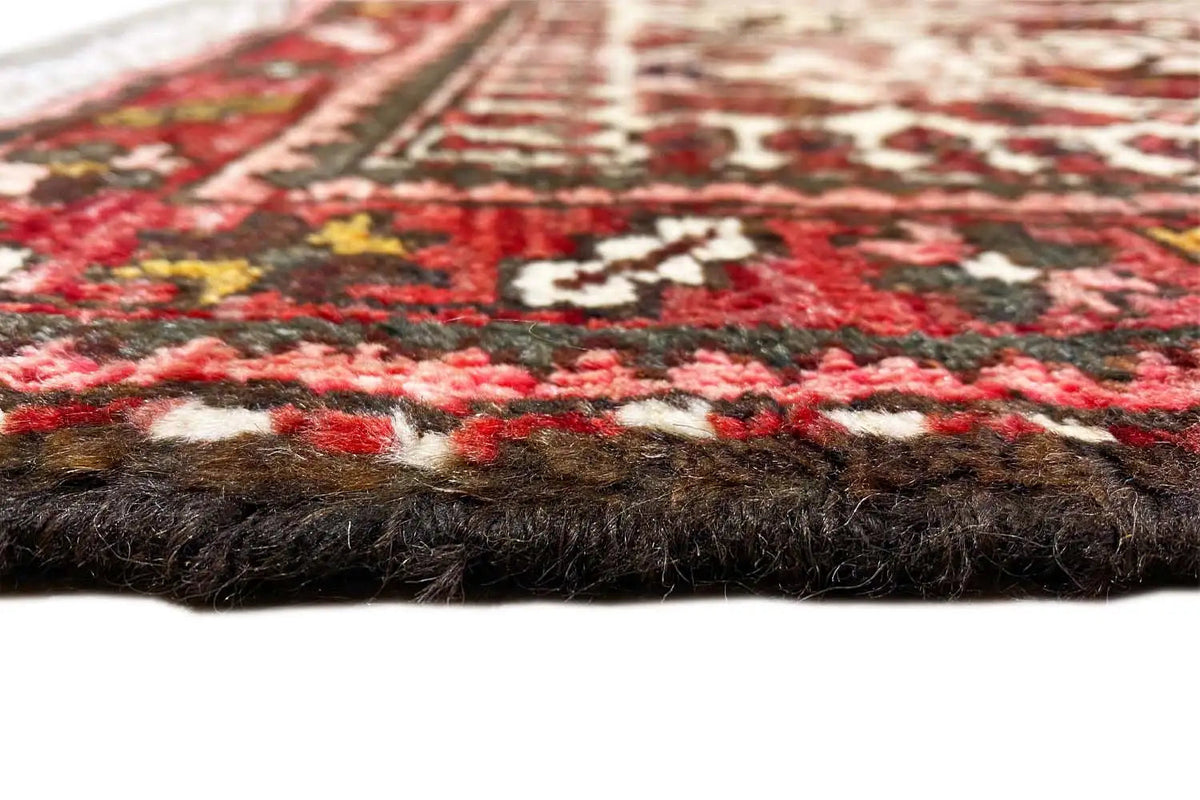 Carpet edge with pile and underside, visible textile border with a dark background
