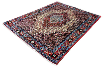 Hamadan rug with a diamond pattern, central medallion, and dark border
