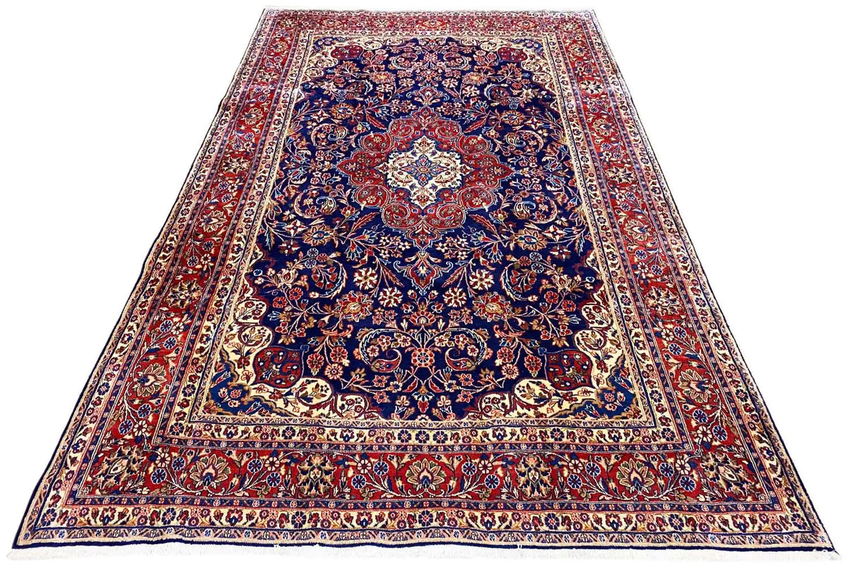 Hamadan rug with a blue and red ornamental pattern, a wide border and central medallion