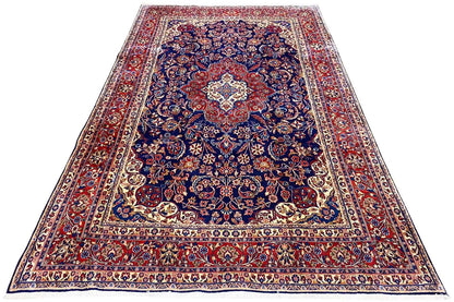 Hamadan rug with a blue and red ornamental pattern, a wide border and central medallion