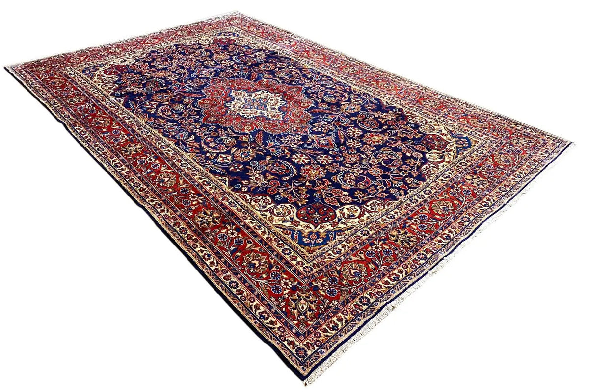 Rug with a diagonal cut: dark blue with a red accent, medallion in the center