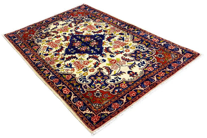 Rug with a dense ornamental pattern, floral motifs, and colorful accents in blue and red