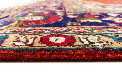 Carpet edge with red pile and a hemmed border, visible carpet thickness