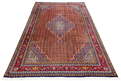 Rectangular Moud rug, reddish background with a central medallion design