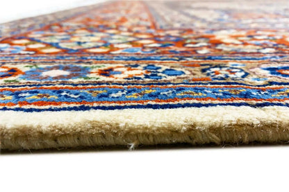 Rug edge with fringe and multicolored pile on a beige background