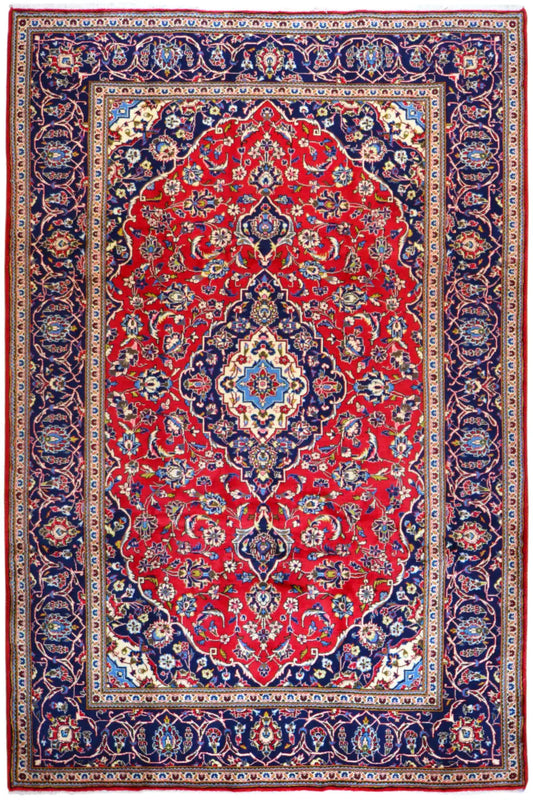 Keshan rug, rectangular: red central field with blue ornamental border and medallion