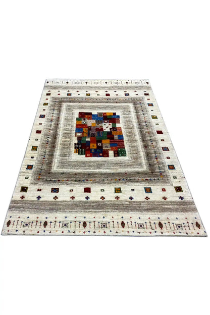 Gabbeh rug (150x102 cm), flat-laid: cream, centered patchwork square and border motifs