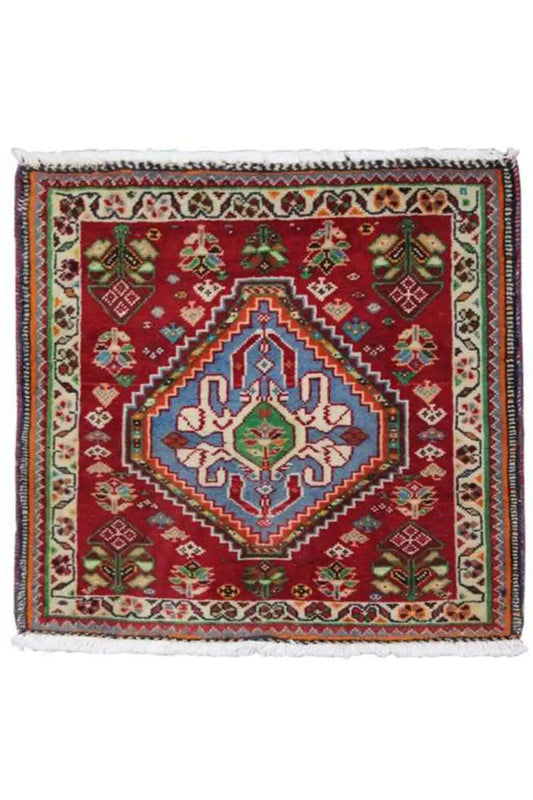 Square rug 63x60 cm with a red base, cream border, and blue central ornament