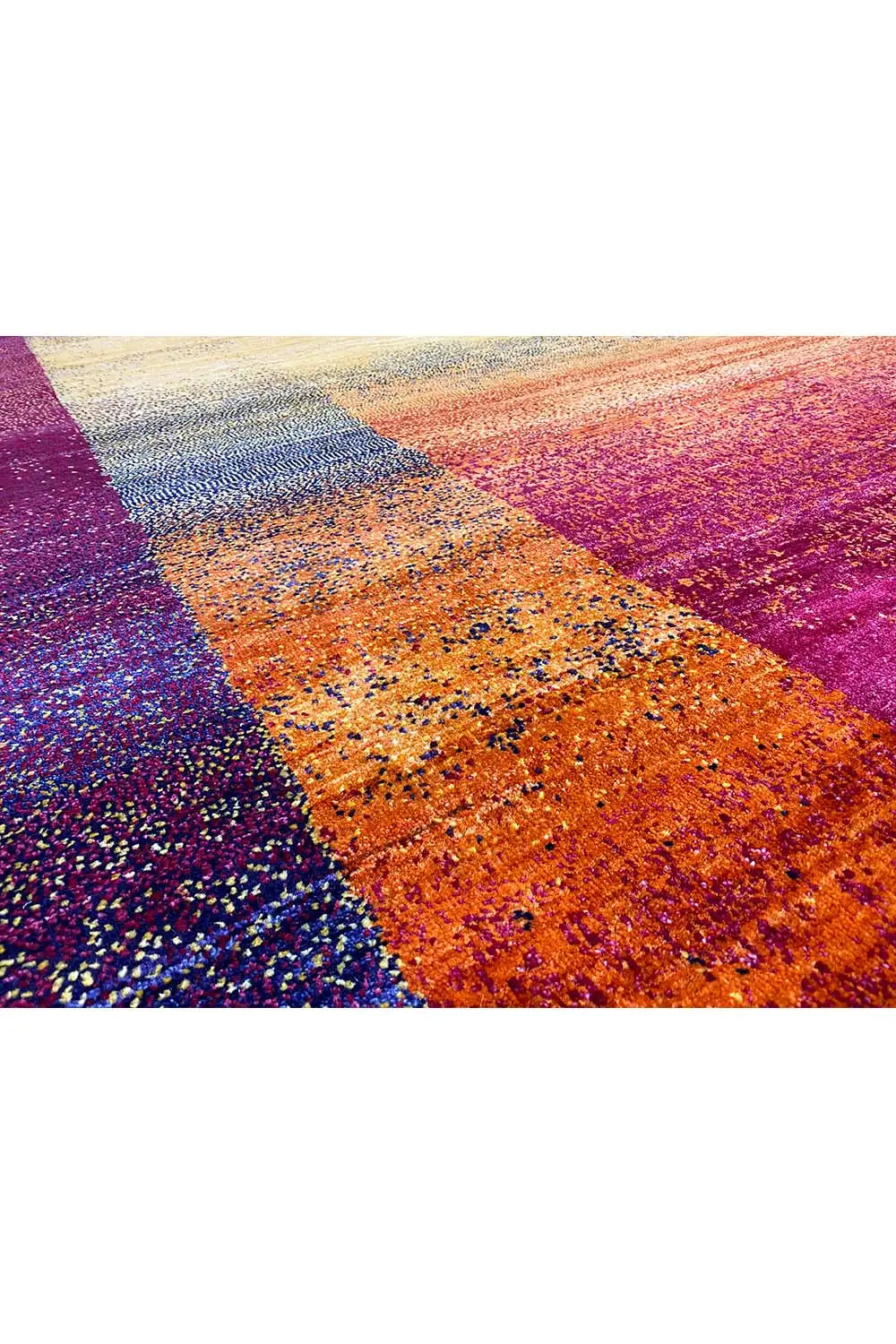Gabbeh rug detail: orange and magenta areas, grainy texture
