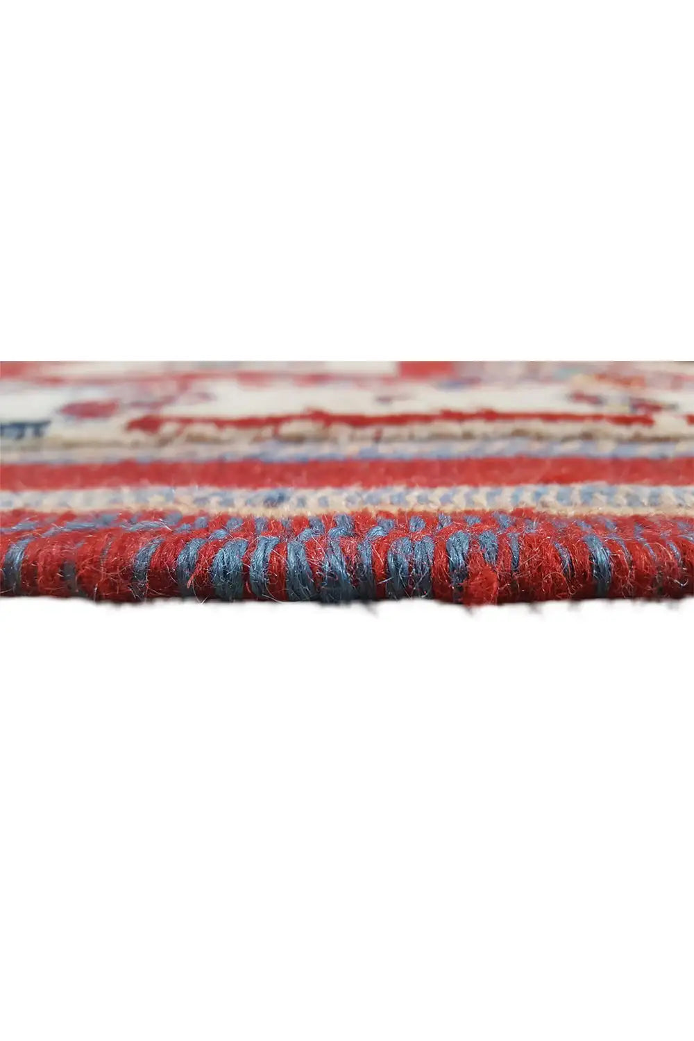 Oriental rug runner end with red fringe trim