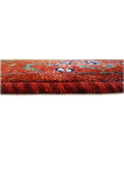 Carpet pile in reddish brown, close-up of the textile surface from the side