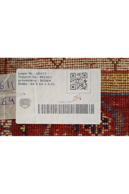 Label on the carpet with a QR code and material information, on beige fabric