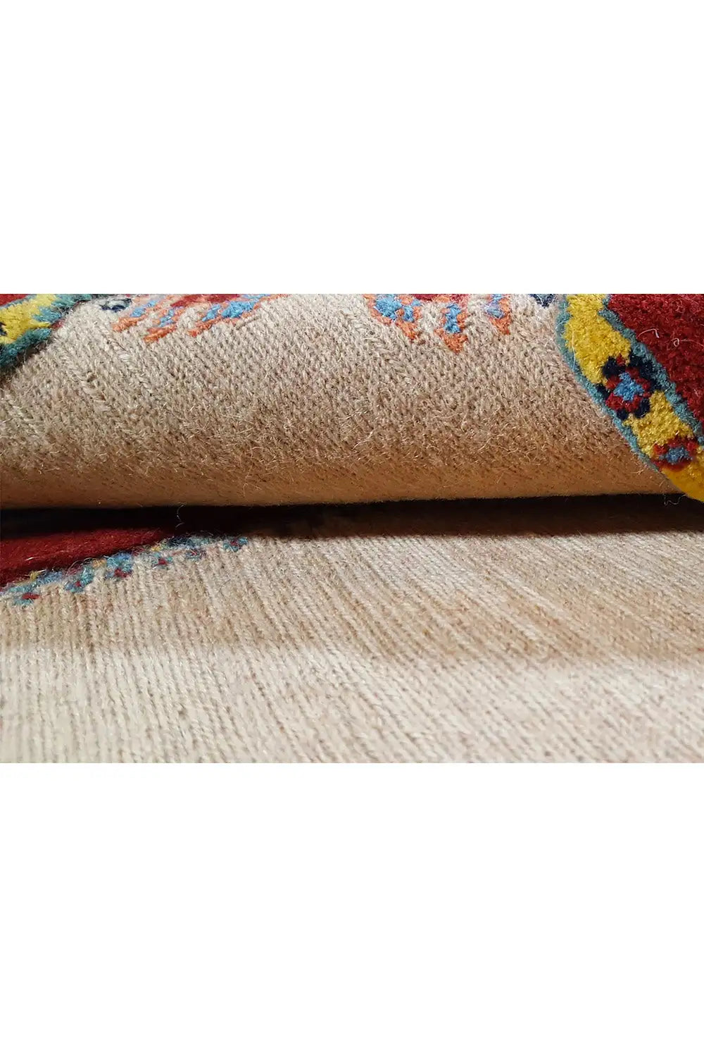 Soumak rug: beige pile with colorful decorative stripes in the close-up view