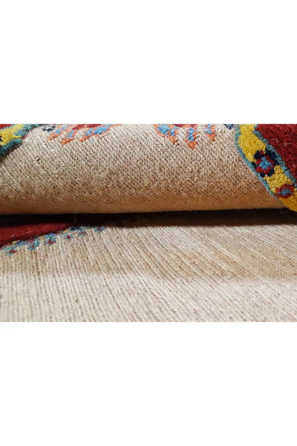 Soumak rug: beige pile with colorful decorative stripes in the close-up view