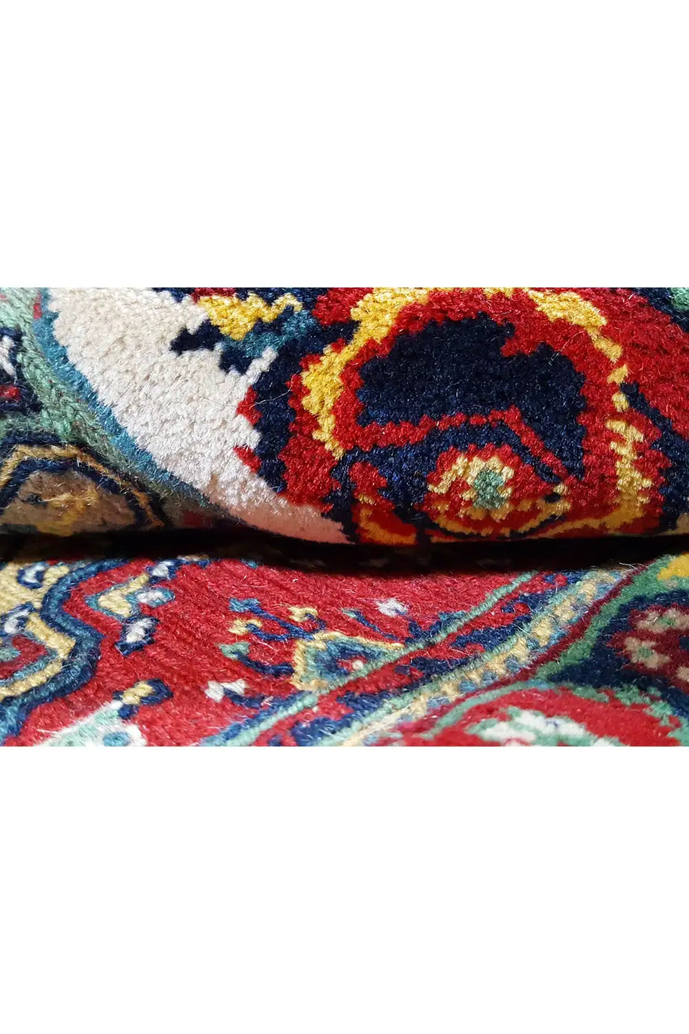 Soumak rug, close-up: pile and twisted edge with shades of red, blue, and yellow