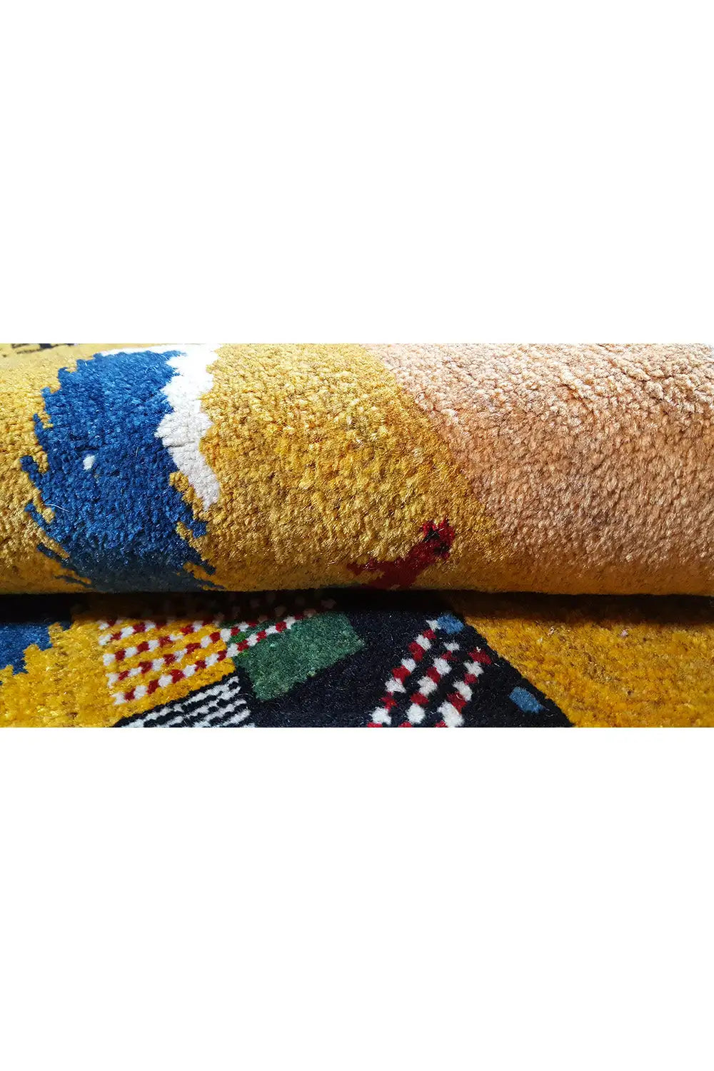 Gabbeh rug Lori (143x103 cm) close-up: yellow pile, blue-and-white area