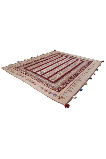 Soumakh rug, beige base with a red diamond pattern and multicolored tassels at the corners
