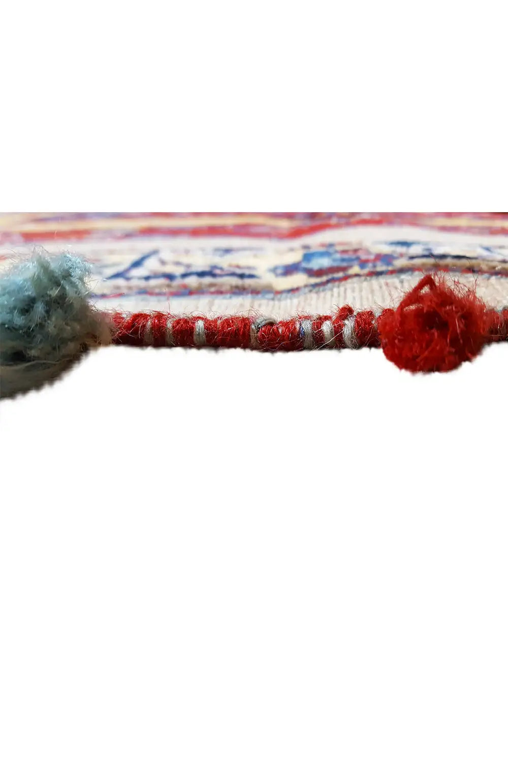 Rug edge with fringes and colorful tassels, multicolored woven pattern