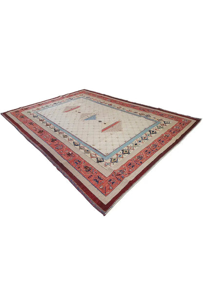 Rug with a red border and beige background, central blue diamond pattern