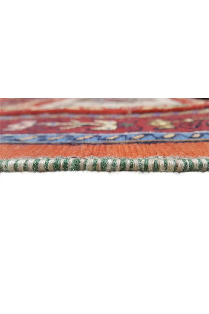 Runner rug detail: selvedge with green-and-white threads and a red-and-blue striped pattern.