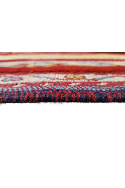 Close-up of the carpet edge, colorful fringe, and multilayered border