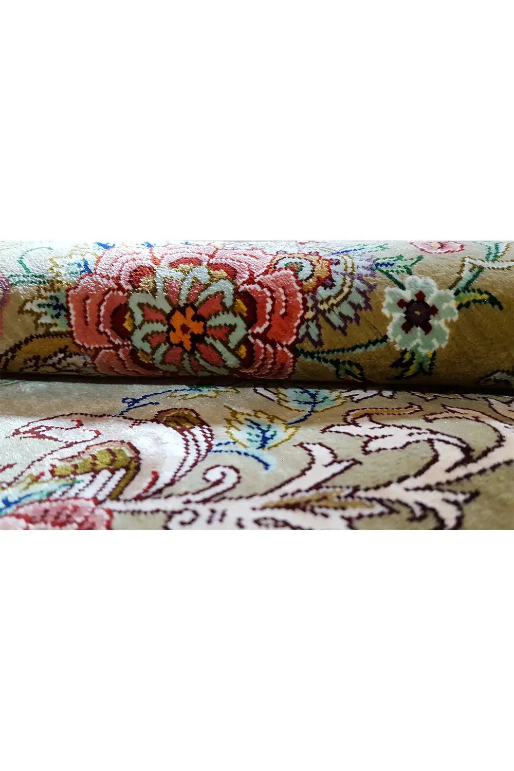Silk rug in olive with colorful floral borders and decorative lines, with fringes
