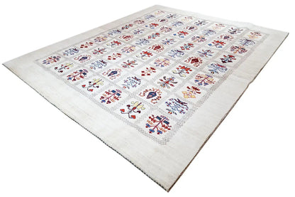 Gabbeh Lori rug on a beige background with colorful floral motifs and a border.