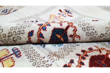 Carpet detail: colorful animal and ornamental motifs on a beige background, crisp pile.