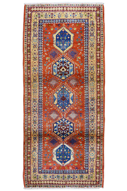 Shiraz rug with a vertical medallion pattern, red-orange, blue and yellow-beige